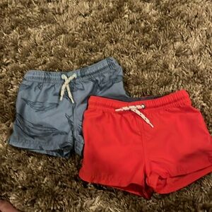 Pair of Carter’s little planet swim trunks, 24 months